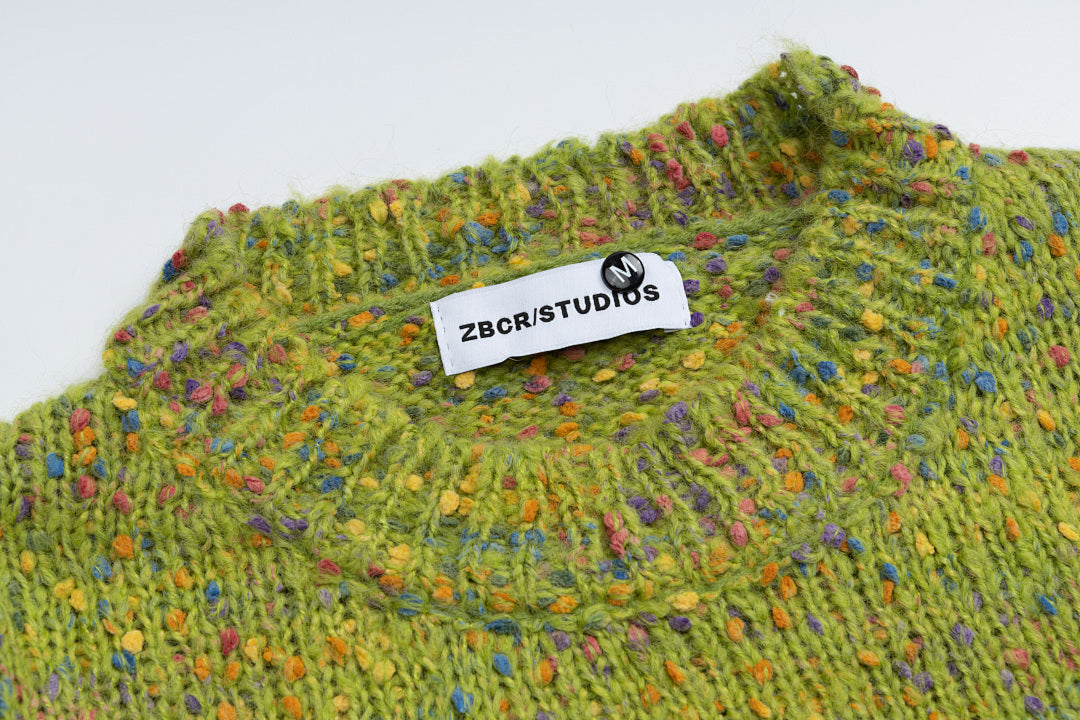 Speckled Knit Sweater With Crochet Rocking Horse Patch